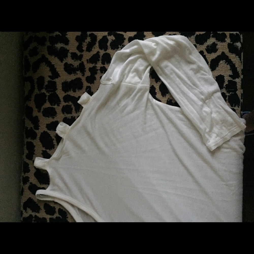 Off white top with cut outs on sleeves.Make offer